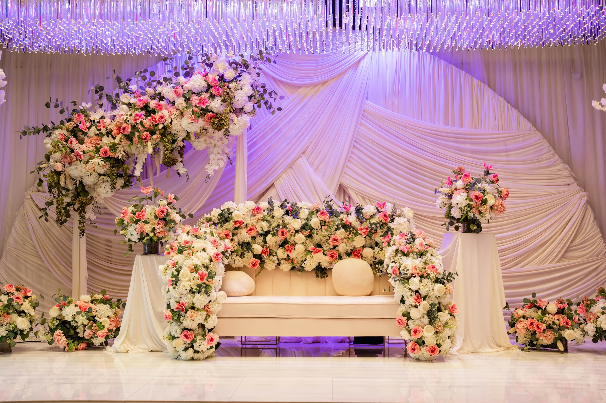 White floral arch decoration for wedding ceremony at event venue near Austin TX